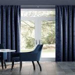 How do you create a cohesive look with Blackout curtains in a living area with multiple windows